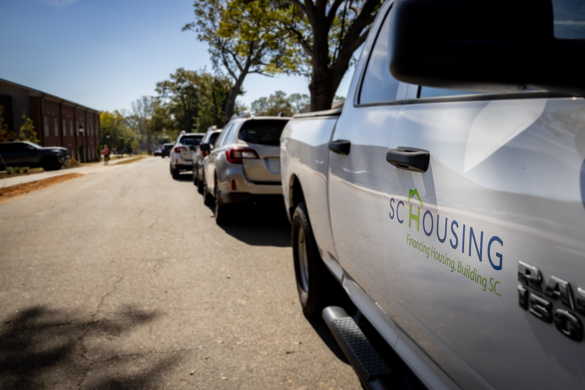 A truck with the SC Housing logo on the passenger side door.